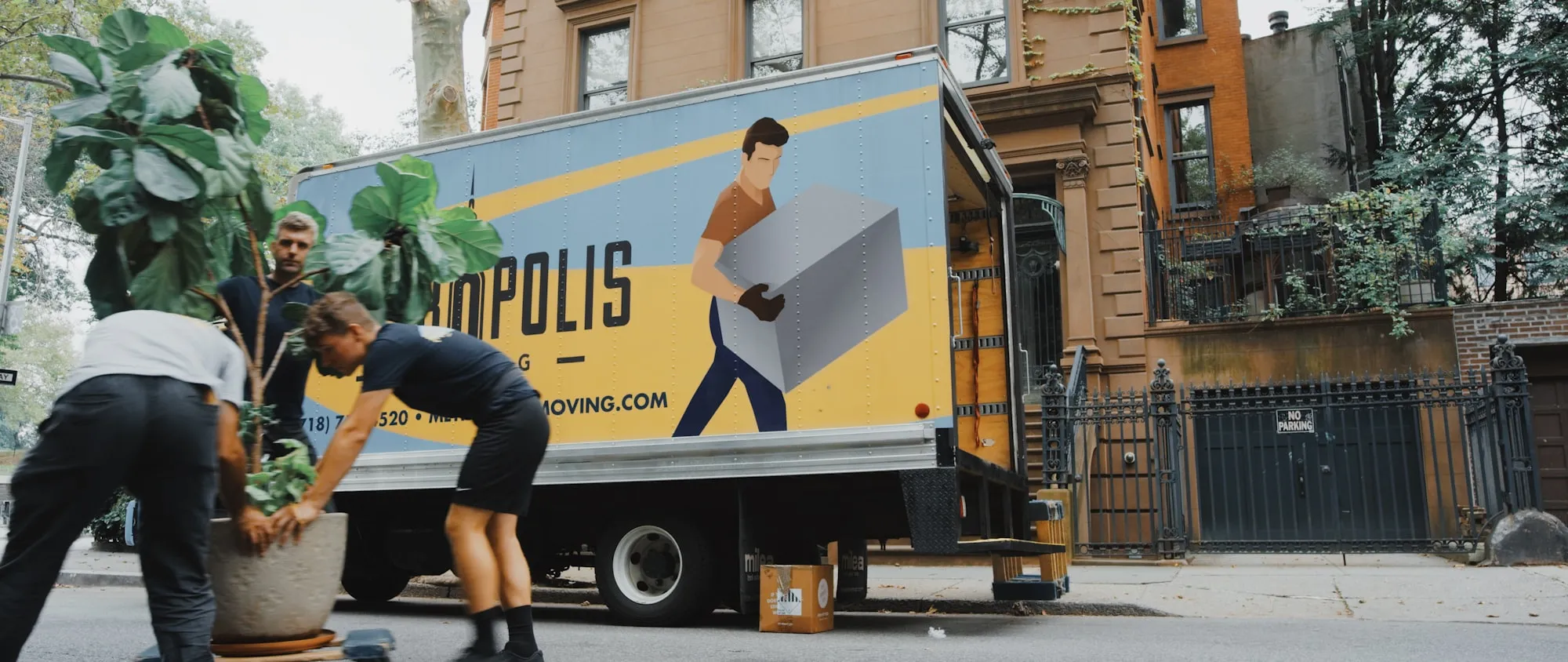 Removalists carrying boxes on moving day